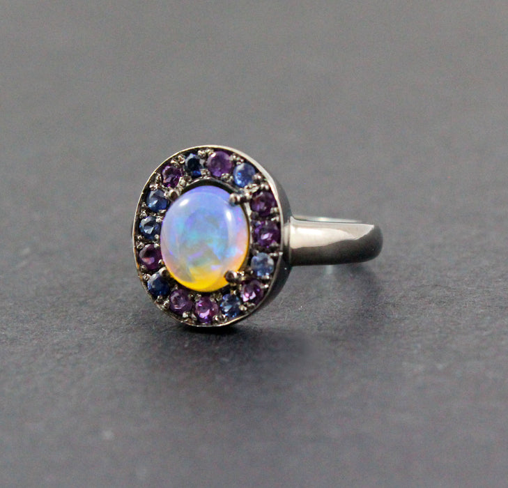 Australian jelly opal with amethyst and blue sapphire halo oxidized black gold ring