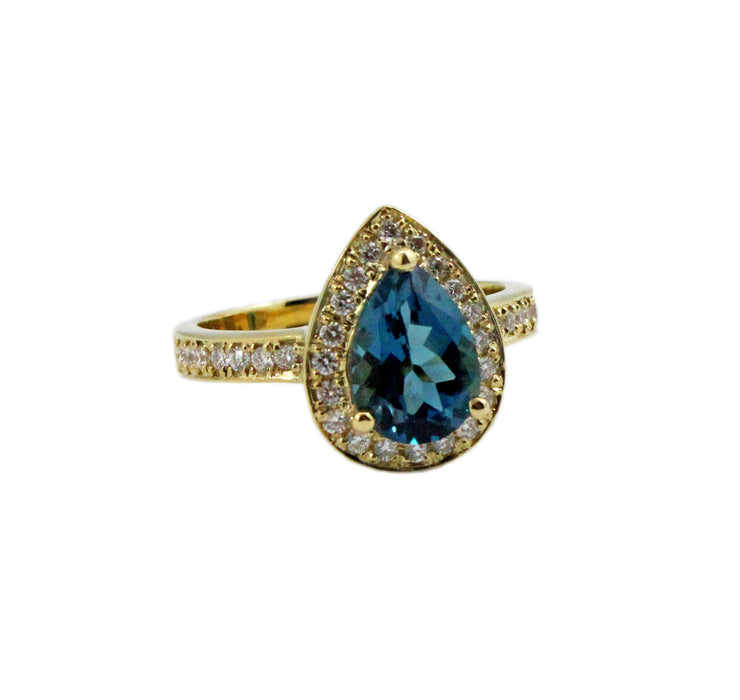 London blue topaz pear with diamond halo set in yellow gold ring
