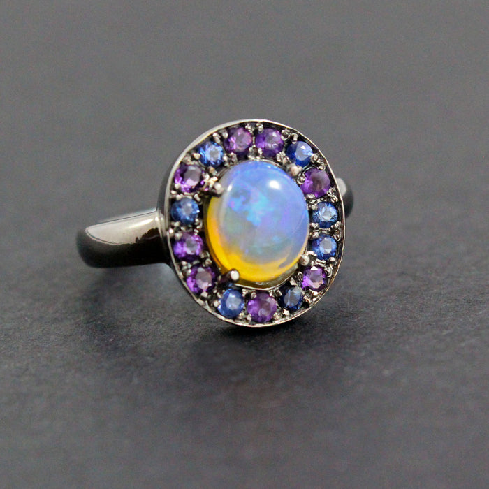 Australian jelly opal with amethyst and blue sapphire halo oxidized black gold ring