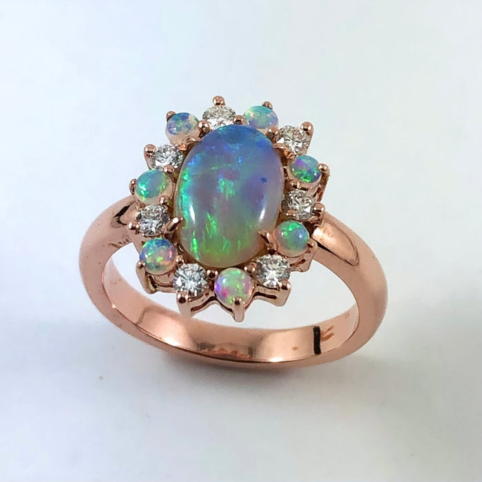 Australian black opal and diamond halo 14k rose gold ring