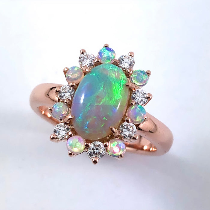 Australian black opal and diamond halo 14k rose gold ring